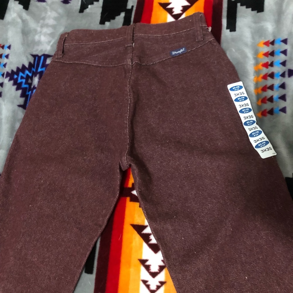 Vintage maroon bareback wranglers